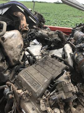 Scrap Metal Collection Featuring Engine Parts in Rural Manitoba