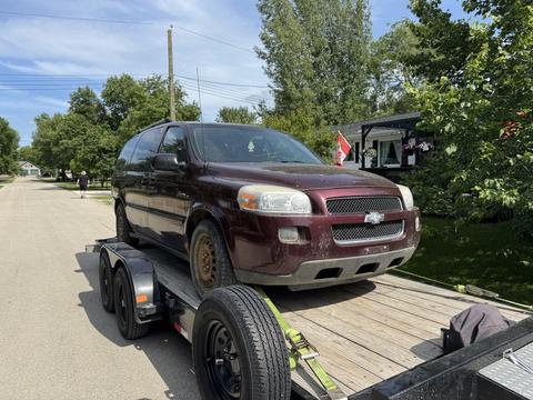 Scrap Vehicle Loaded on Trailer for Recycling Pickup