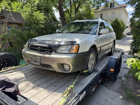 Old Car Loaded on Trailer for Scrap Metal Recycling