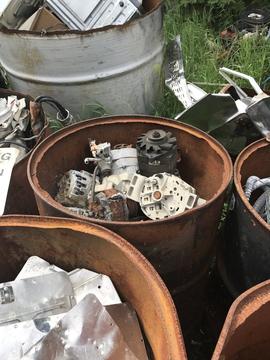 Rusty Barrels Filled with Assorted Scrap Metal Parts