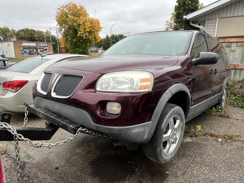 Towing a Maroon SUV for Scrap Metal Recycling