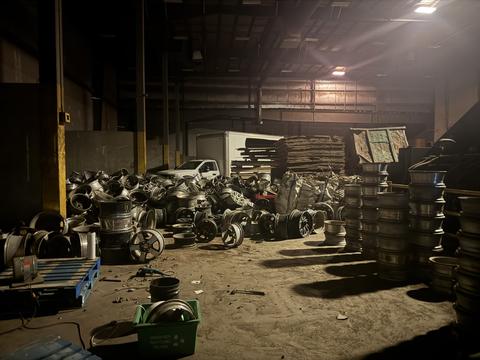 Scrap Metal Recycling Facility with Abundant Aluminum Wheels and Materials